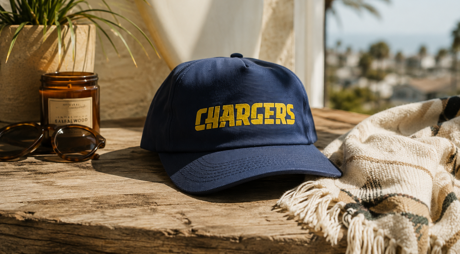 San Diego Chargers Hat sitting in someones room overlooking palm trees