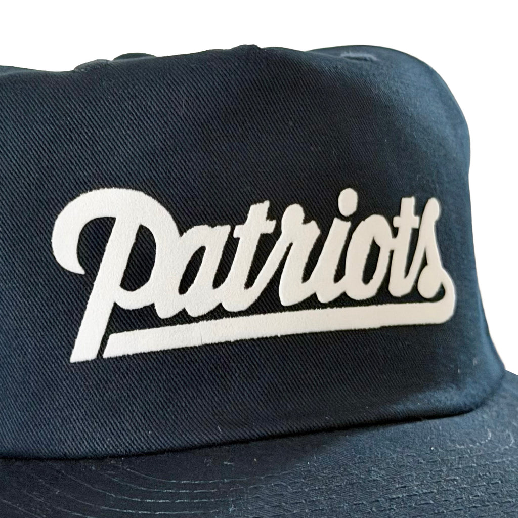Vintage New England Patriots Script Hat | 5 Panel Snapback Hat in black with a white Patriots script logo and curved brim from My Store