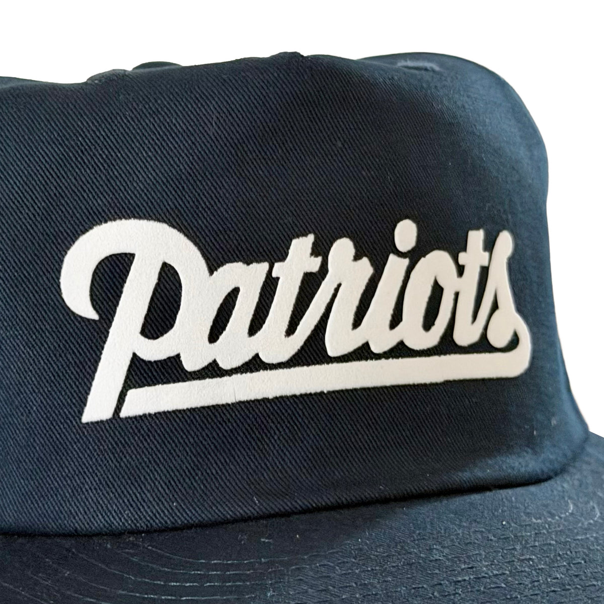 Vintage New England Patriots Script Hat | 5 Panel Snapback Hat in black with a white Patriots script logo and curved brim from My Store