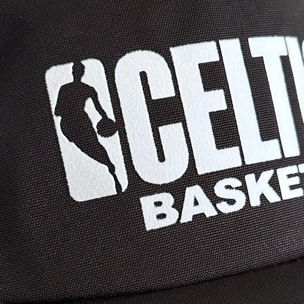 Vintage Boston Celtics Hat | 5 Panel Black Snapback Hat, close up of black fabric with white Celtics basketball logo by My Store in Home page and Basketball