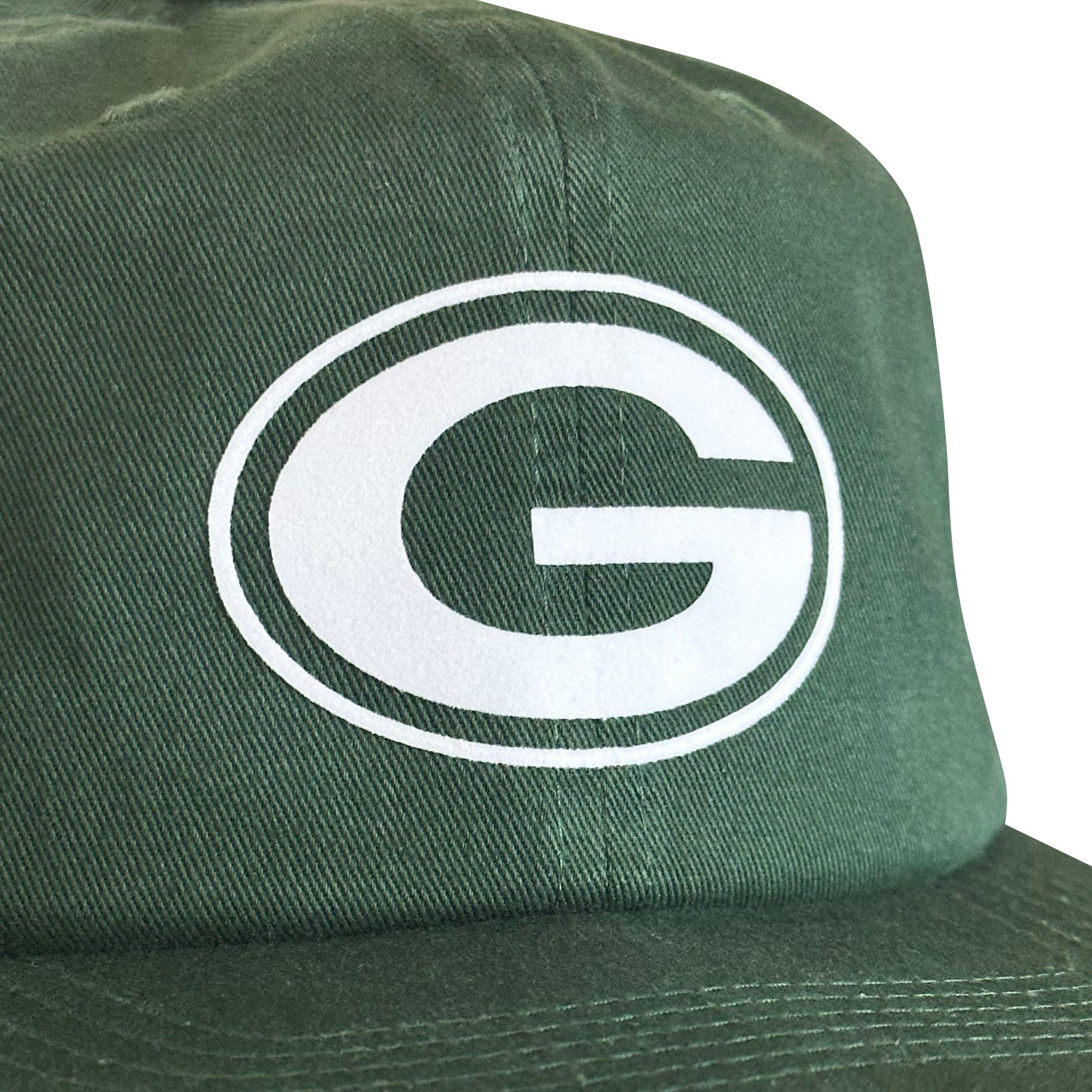 Vintage Green Bay Packers Hat | 6 Panel Snapback Hat, close-up of a green cap featuring a white G logo and curved brim