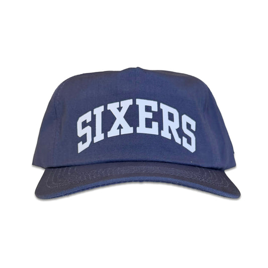 A navy blue baseball cap with 'SIXERS' embroidered in white arched block letters on the front, shown against a plain white background.