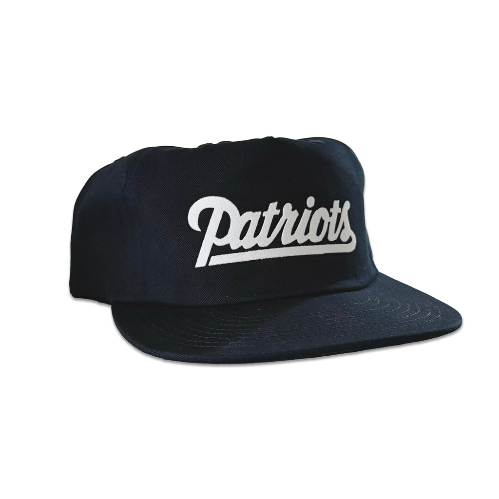 Vintage New England Patriots Script Hat | 5 Panel Snapback Hat in black with white script logo and flat brim, shown from the front side view by My Store